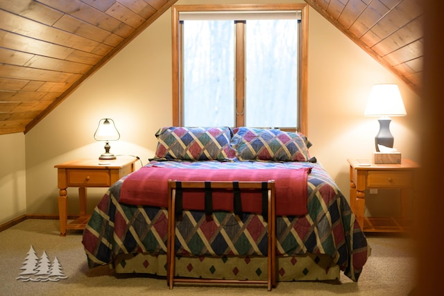 bedroom featuring wooden ceiling, carpet, baseboards, and lofted ceiling