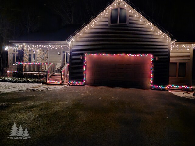 property exterior at twilight featuring a garage