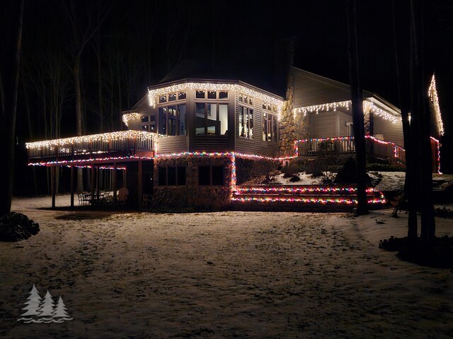 view of back of house at twilight