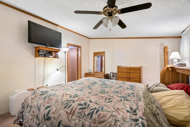 bedroom with a textured ceiling, a ceiling fan, carpet, and ornamental molding