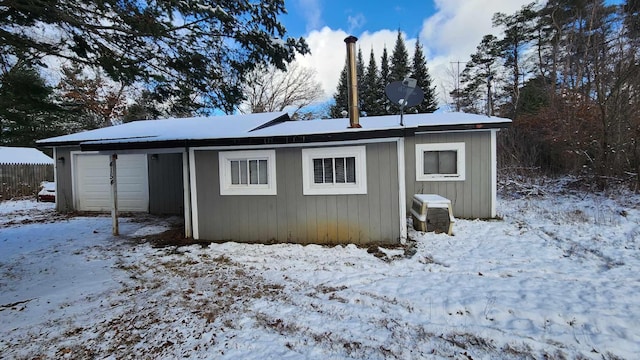 exterior space with a garage and fence