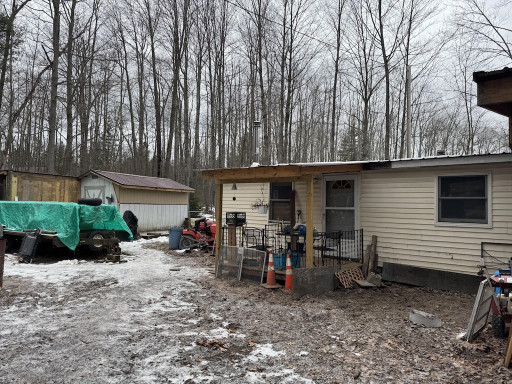 exterior space featuring an outdoor structure and a storage unit