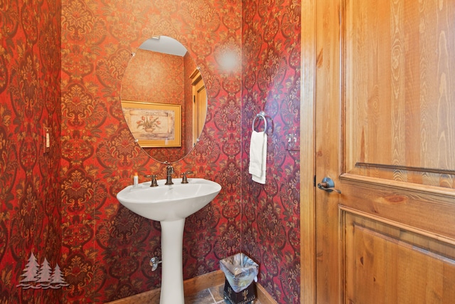 bathroom featuring wallpapered walls