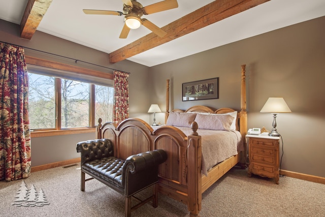 carpeted bedroom with beamed ceiling, baseboards, visible vents, and a ceiling fan