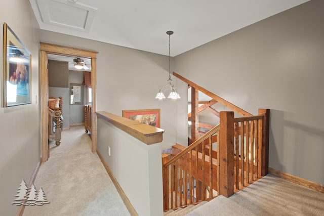 staircase with carpet and baseboards