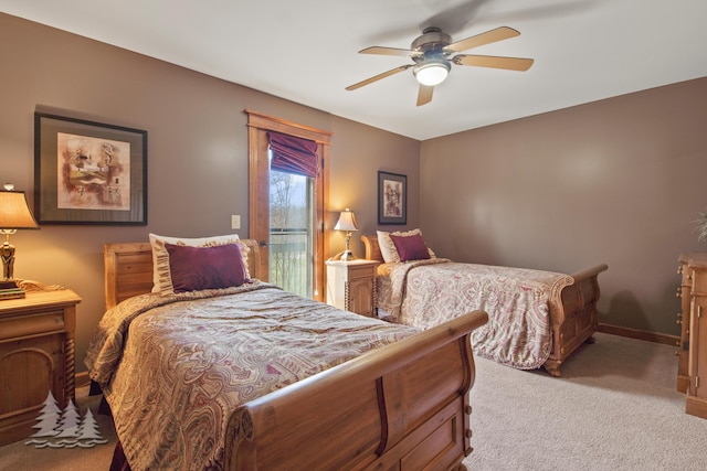 bedroom featuring access to exterior, carpet flooring, a ceiling fan, and baseboards