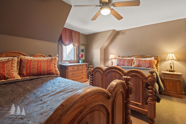 bedroom featuring a ceiling fan, visible vents, and light carpet