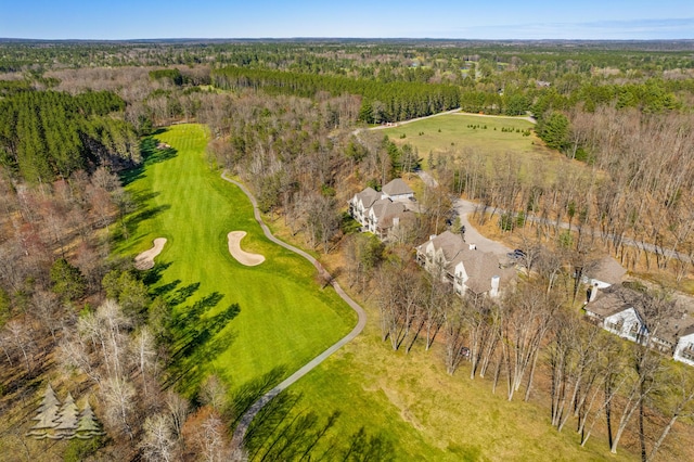 drone / aerial view with a wooded view