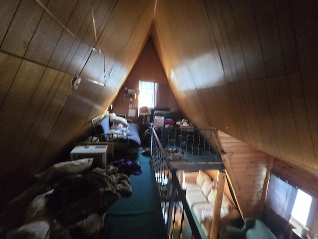 bedroom with lofted ceiling, wood ceiling, and wood walls