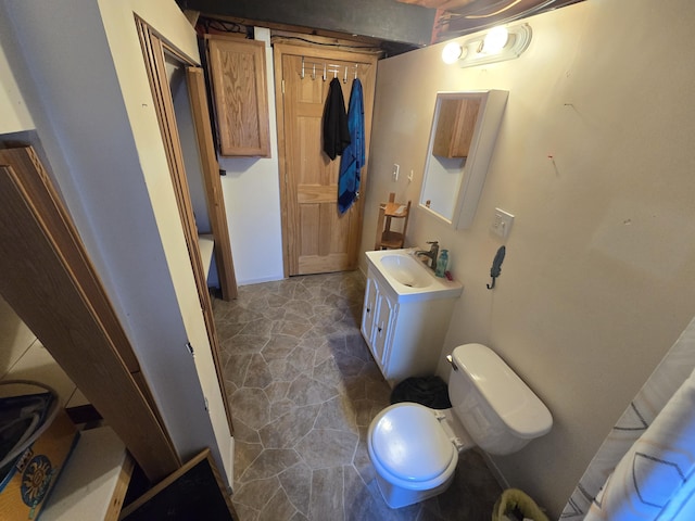 bathroom with toilet and vanity