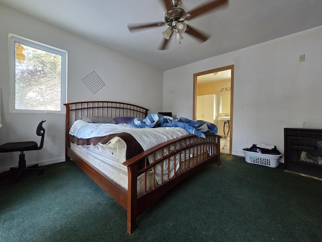 bedroom featuring baseboards, a ceiling fan, and carpet flooring