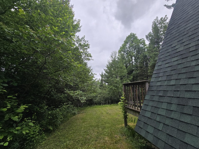 2709 Timberlane Trl, Grayling, MI 49738 - view of grassy yard featuring a wooden deck