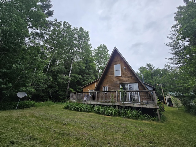 2709 Timberlane Trl, Grayling, MI 49738 - back of house featuring a yard and a deck