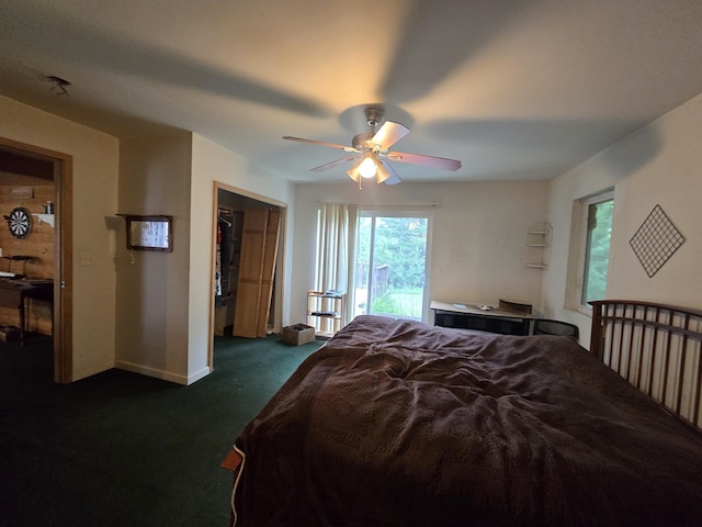 2709 Timberlane Trl, Grayling, MI 49738 - bedroom featuring dark carpet, ceiling fan, and a closet