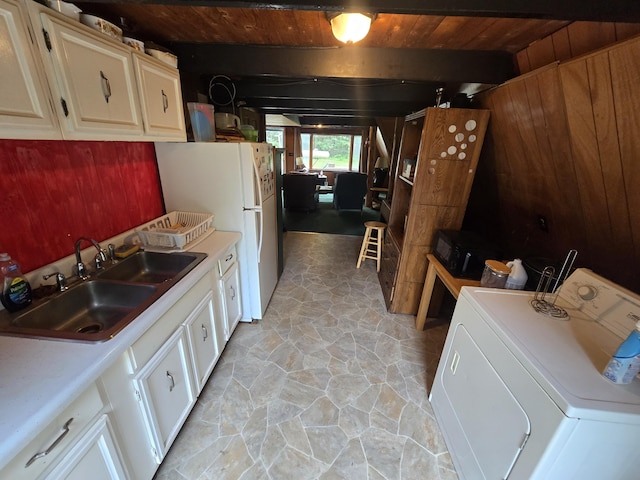 2709 Timberlane Trl, Grayling, MI 49738 - laundry area featuring washer / clothes dryer, wood ceiling, and stone flooring