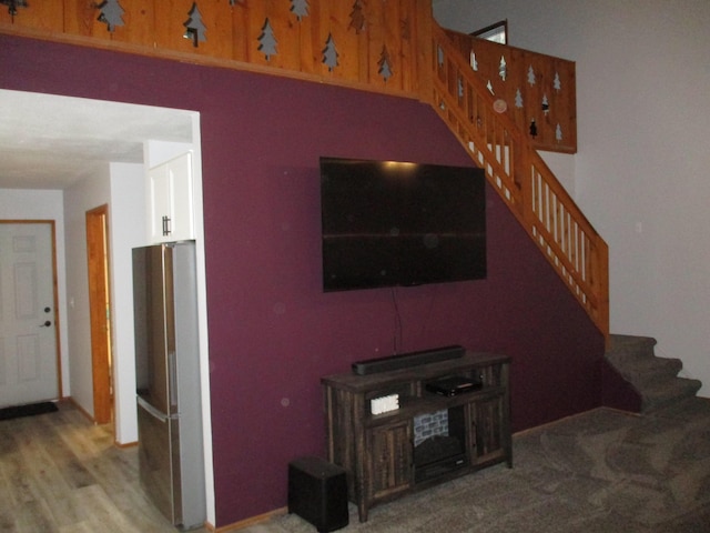 stairway featuring wood finished floors