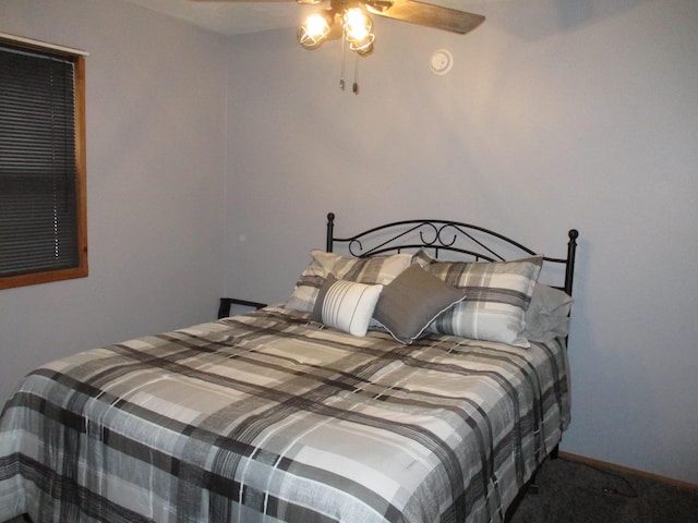 carpeted bedroom with a ceiling fan