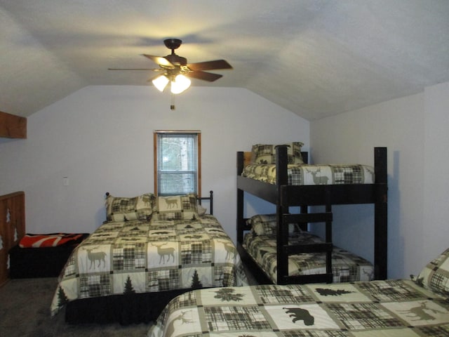 bedroom featuring a ceiling fan and lofted ceiling