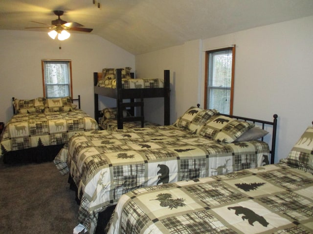 carpeted bedroom featuring vaulted ceiling and a ceiling fan