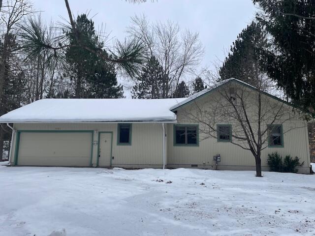 view of front of property featuring crawl space and an attached garage