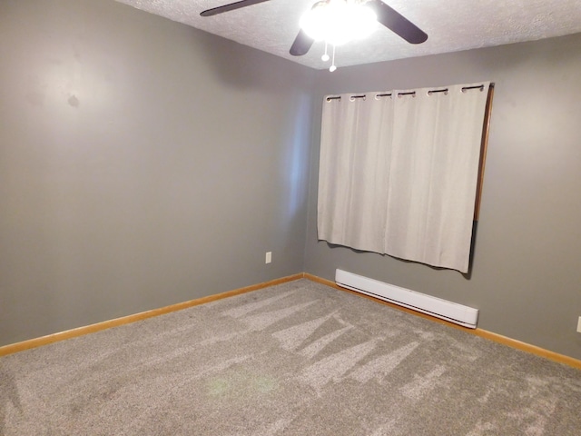 carpeted spare room featuring a baseboard heating unit, baseboards, a textured ceiling, and a ceiling fan