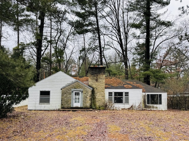 view of front of house featuring a chimney