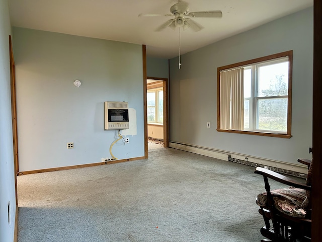 unfurnished living room featuring heating unit, baseboards, carpet floors, ceiling fan, and baseboard heating