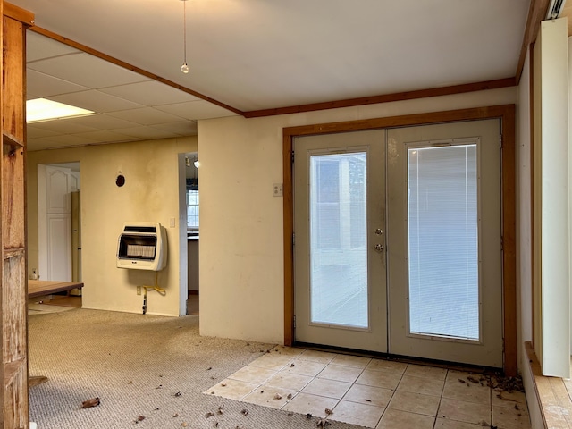 doorway to outside with a drop ceiling, french doors, and heating unit