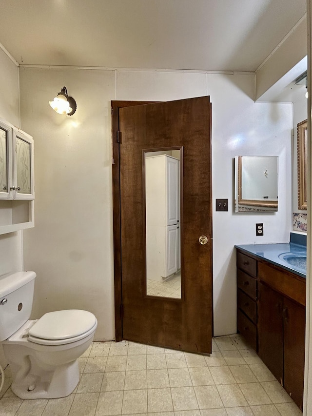 bathroom with toilet and vanity