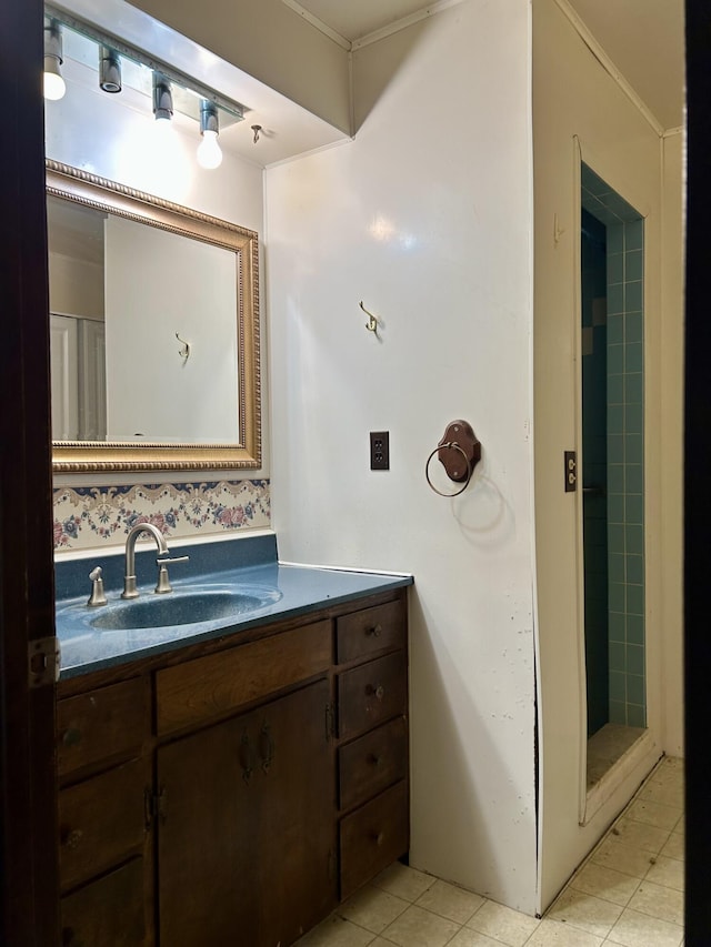 bathroom with a stall shower, vanity, and tile patterned flooring