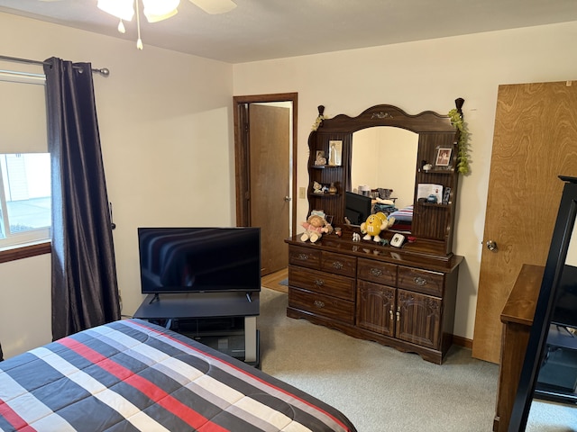 bedroom with a ceiling fan and carpet floors