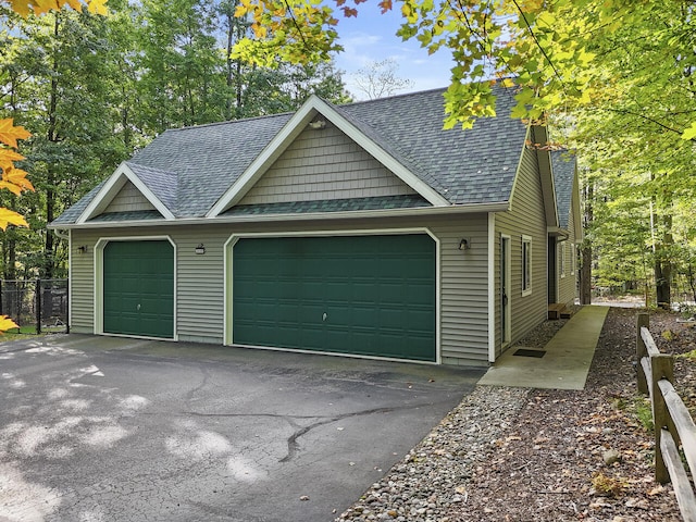 garage featuring fence