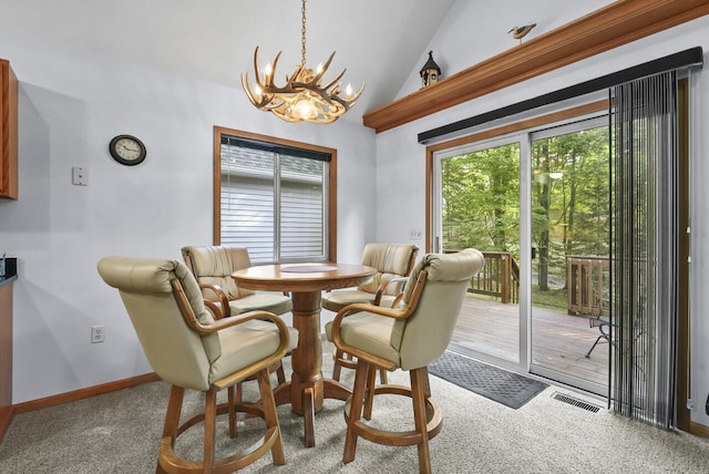 dining area featuring visible vents, baseboards, lofted ceiling, carpet floors, and a notable chandelier