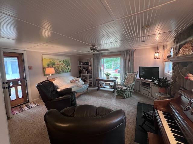 living room with carpet and a ceiling fan