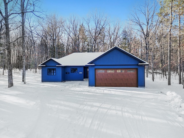 view of snow covered garage