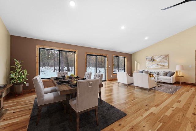 dining area featuring recessed lighting, baseboards, lofted ceiling, and light wood-style floors