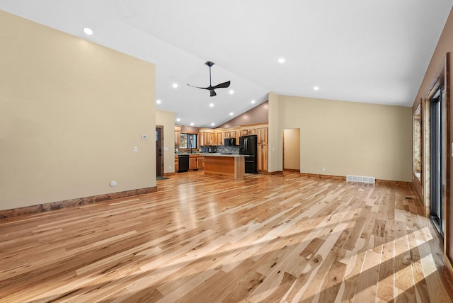 unfurnished living room featuring visible vents, light wood-style flooring, recessed lighting, baseboards, and lofted ceiling