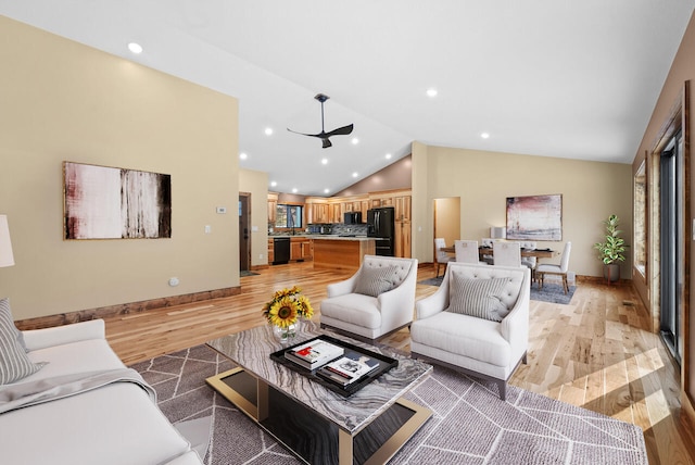 living area featuring recessed lighting, light wood-type flooring, baseboards, and vaulted ceiling