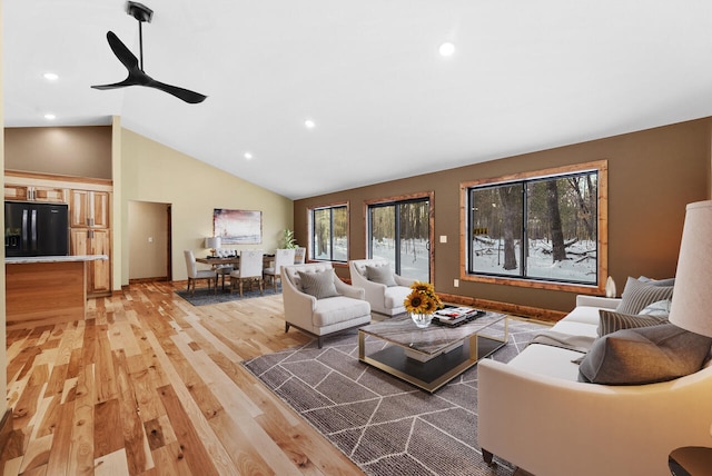 living room featuring recessed lighting, ceiling fan, vaulted ceiling, and light wood finished floors