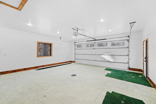 garage with recessed lighting, a garage door opener, and baseboards