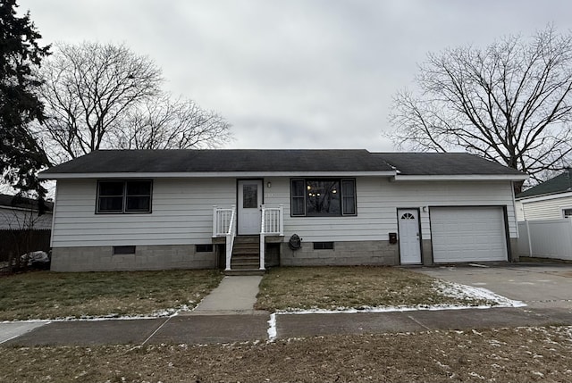 view of front facade featuring concrete driveway, an attached garage, roof with shingles, and crawl space