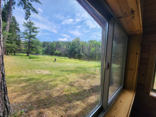 view of yard with a wooded view