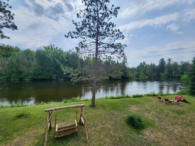 view of water feature with a forest view