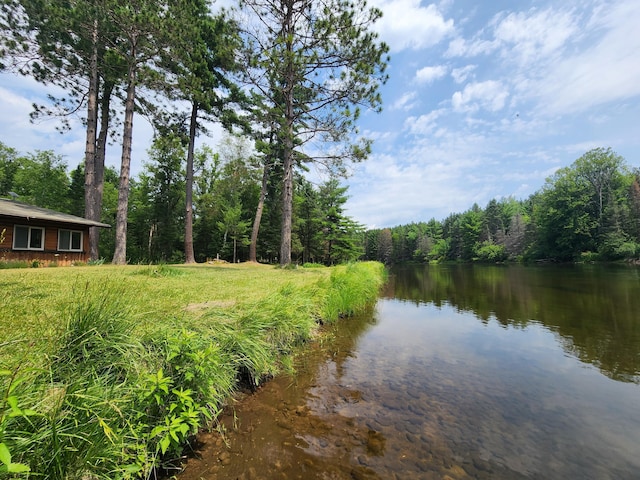 exterior space with a wooded view