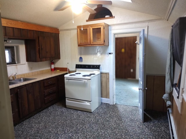 kitchen featuring a sink, a baseboard heating unit, white electric range oven, light countertops, and lofted ceiling