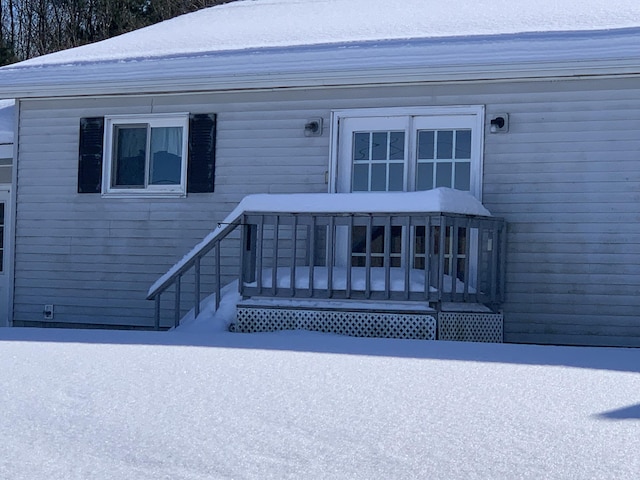 view of snow covered property entrance