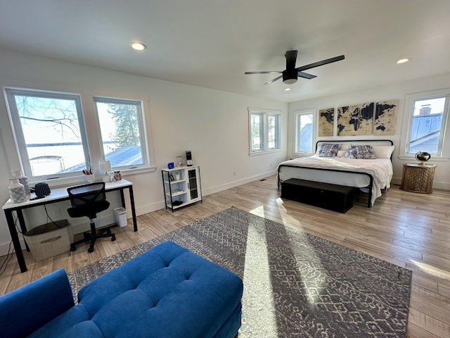 bedroom with recessed lighting, baseboards, and wood finished floors