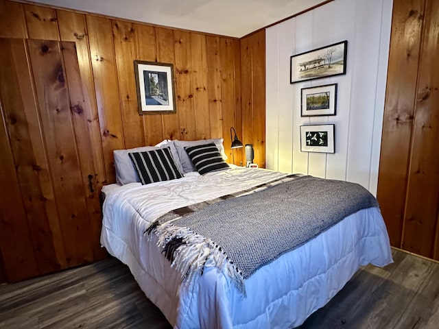 bedroom with dark wood-style flooring