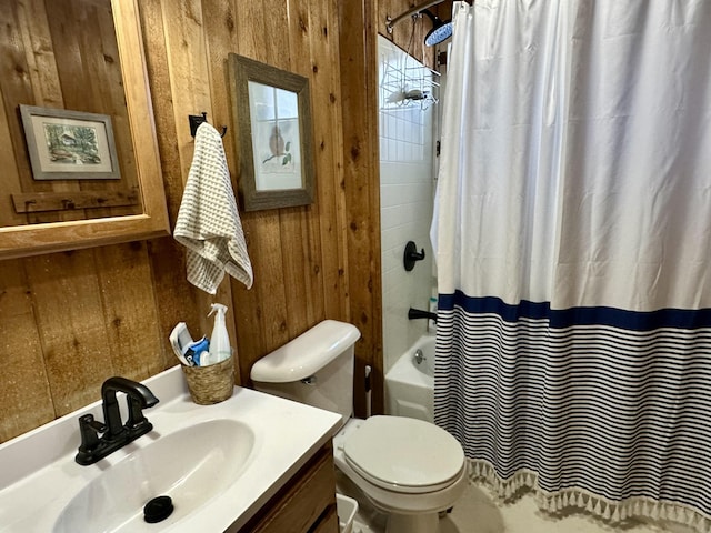 full bathroom with wooden walls, toilet, vanity, and shower / tub combo with curtain