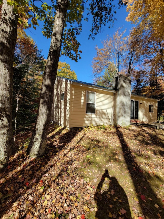 view of side of property featuring a chimney